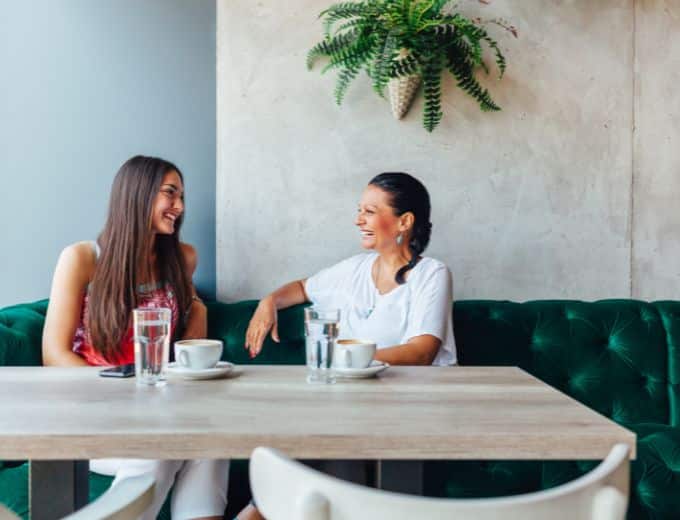 two women talking in coffee shop