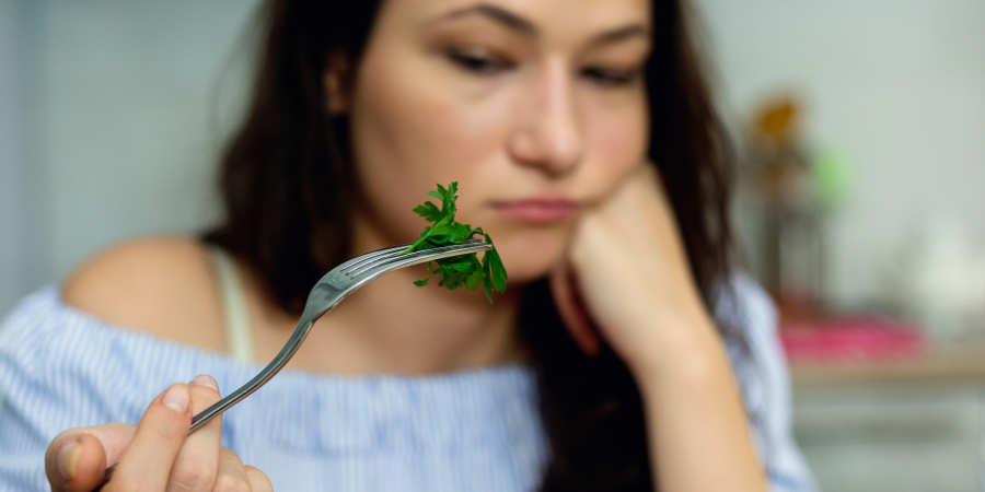 Woman eating lettuce