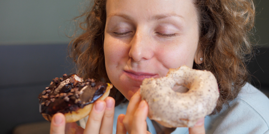 Woman eating donuts