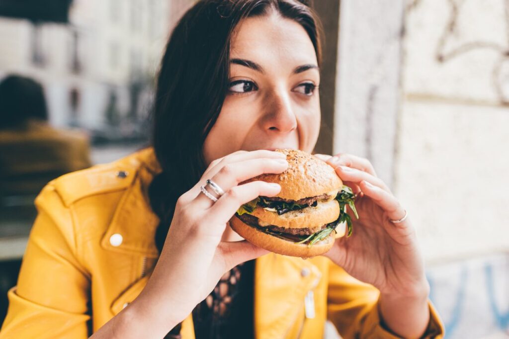 woman eating a burger