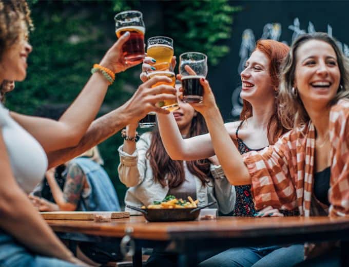 group of women toasting a drink