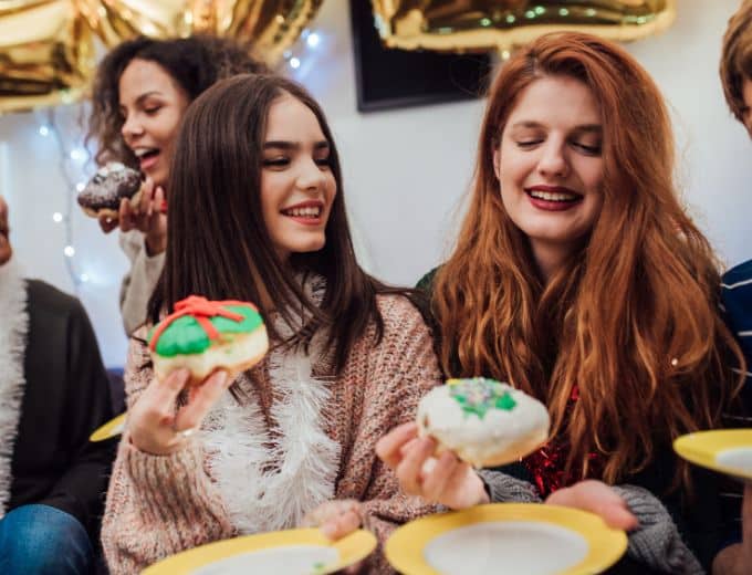 women eating donuts