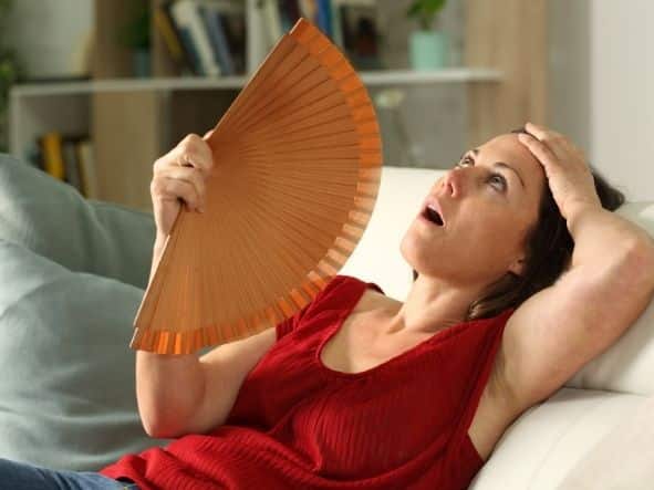 woman fanning herself