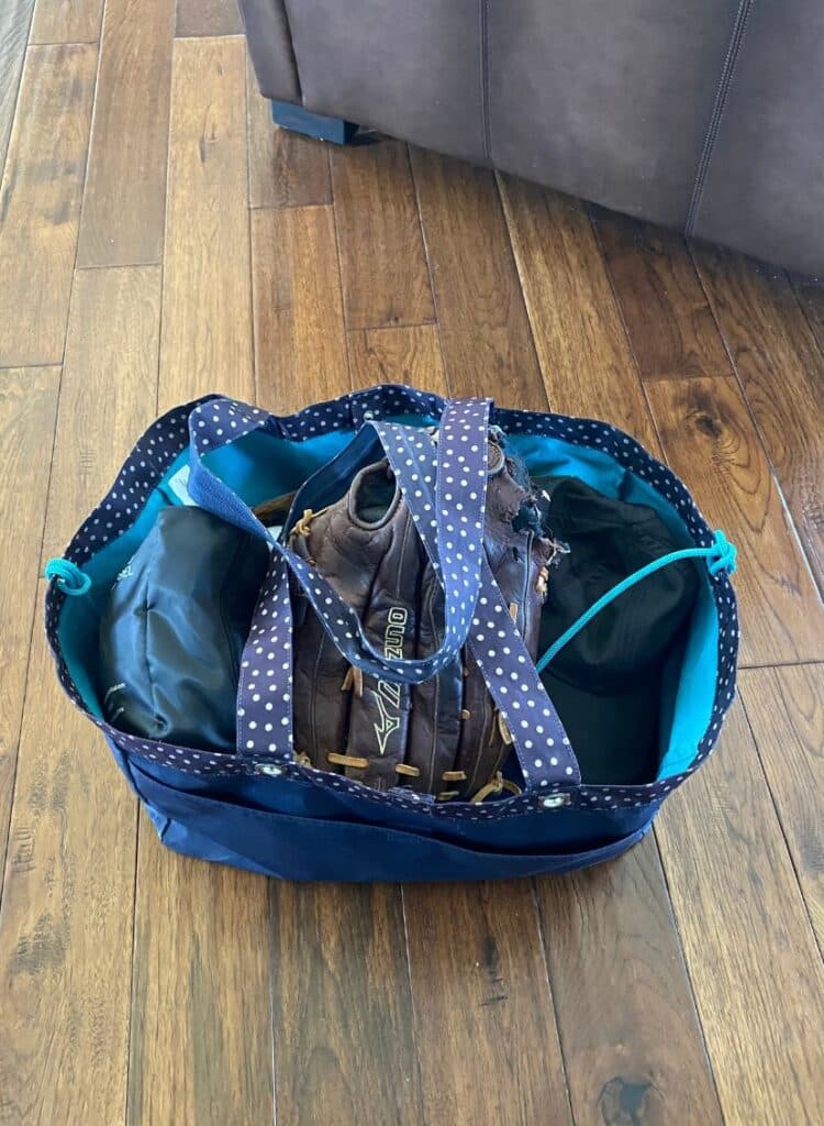 bag packed with baseball mitt