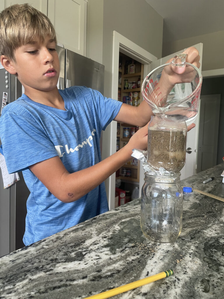 boy doing science experiment